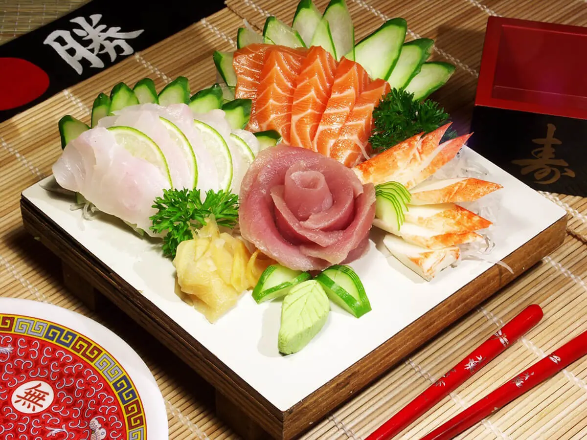 Sushi Sashimi Plate features a selection of sushi and sashimi, including nigiri sushi with fresh fish and sushi rolls at Hokkaido Sushi & Ramen, a Japanese restaurant in Vancouver